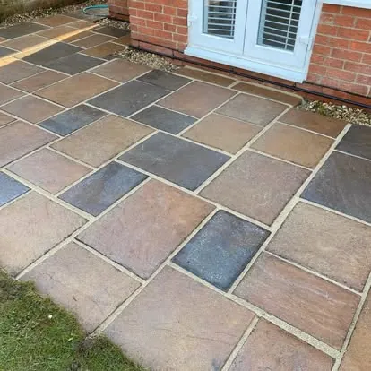 The same patio after cleaning, growth removed from the slabs