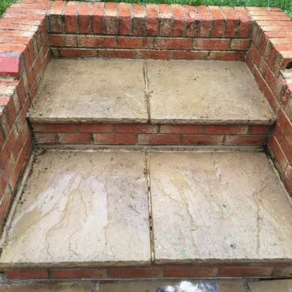 The same stone-topped brick steps after cleaning