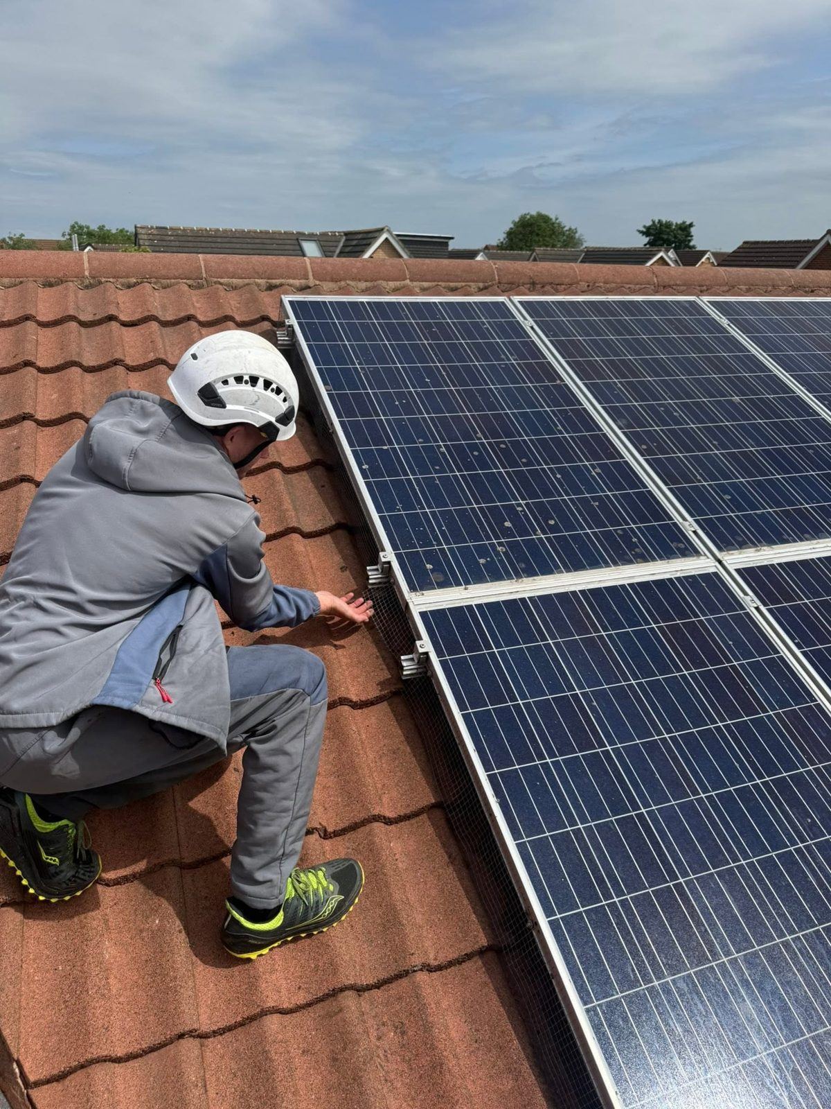 Solar panels being cleaned on a Teesside rooftop